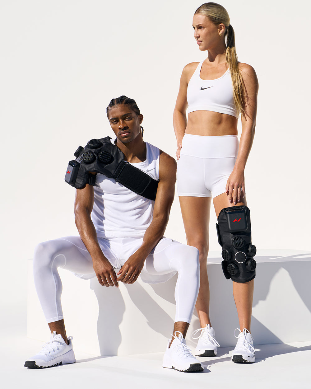 Two athletes using Hyperice contrast technology